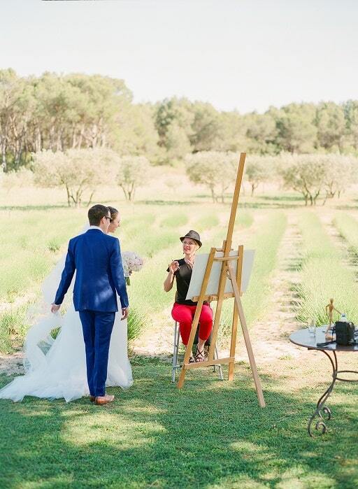 The newlyweds and the live painter after the wedding ceremony, Provence, France